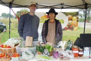 owners of Long Road Ecological Farm, Jonathan Davies and Xiaoeng Shen at the Friday Frontenac Farmers Market in Harrowsmith on August 15